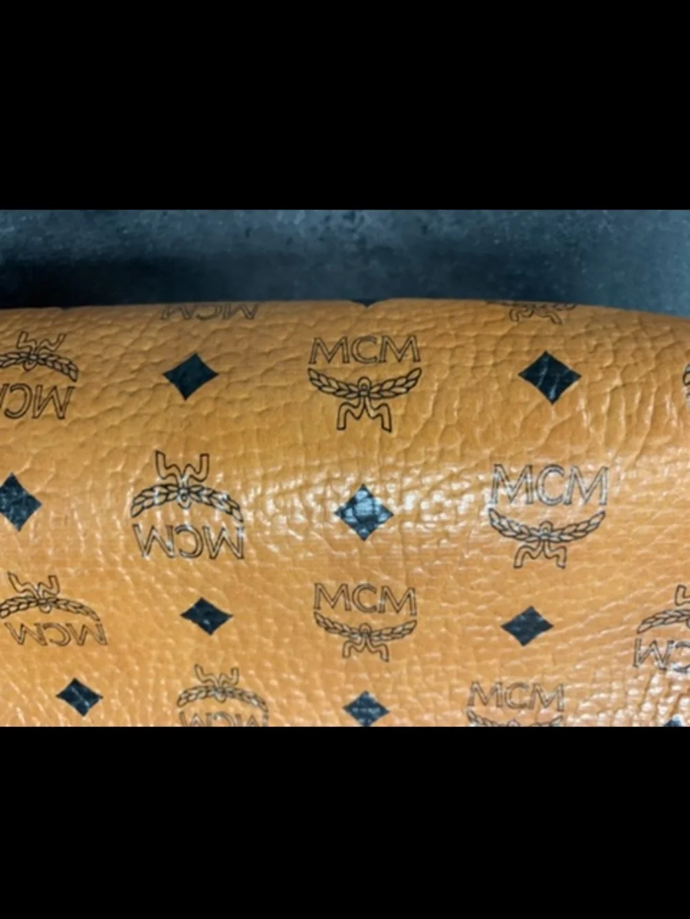MCM Cognac and Black Visetos Monogram Pouch with Gold Plaque.